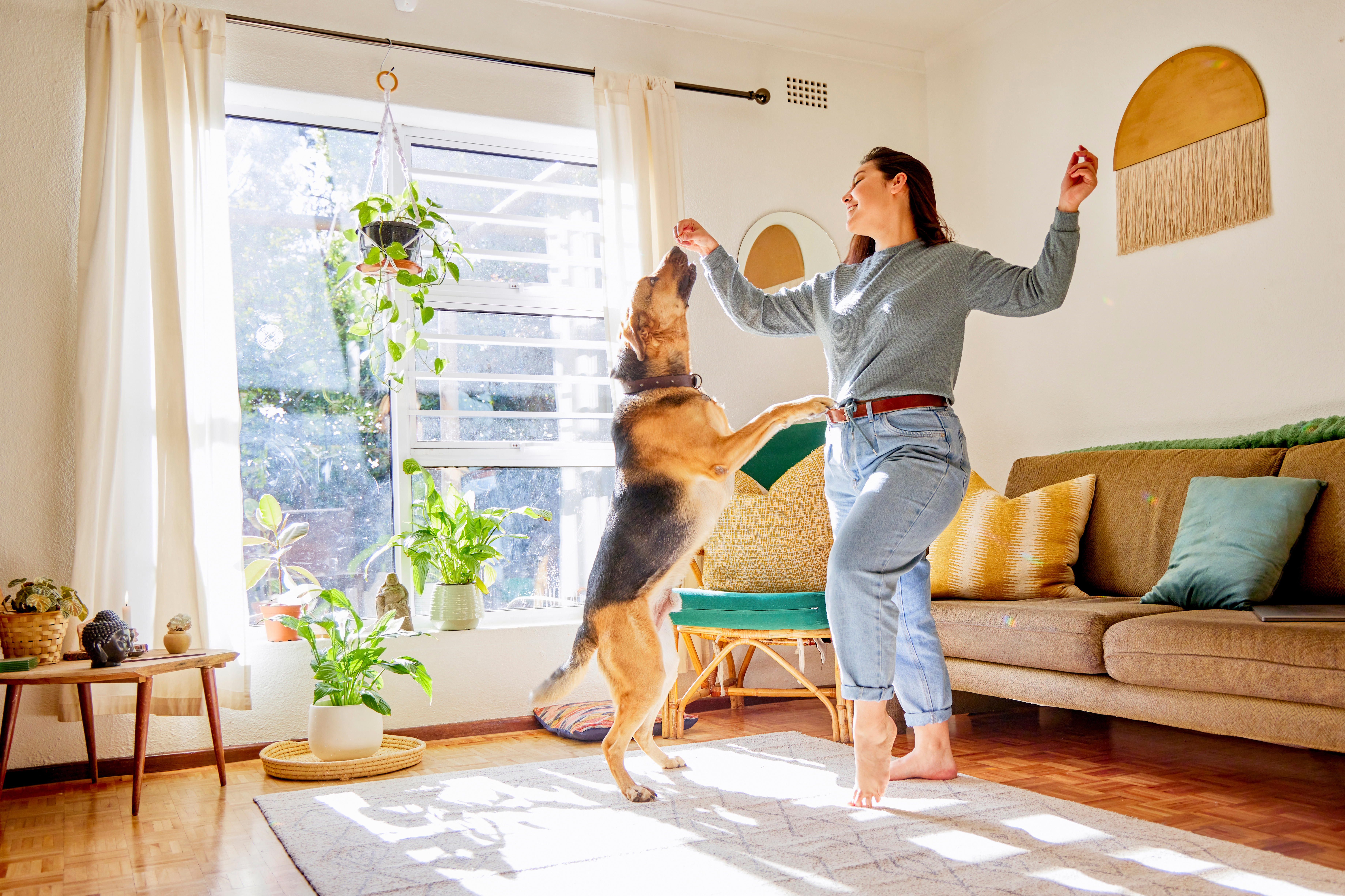woman dancing with her dog